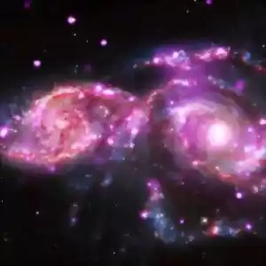 ویدئویی از برخورد کهکشان‌های مارپیچی رنگارنگ